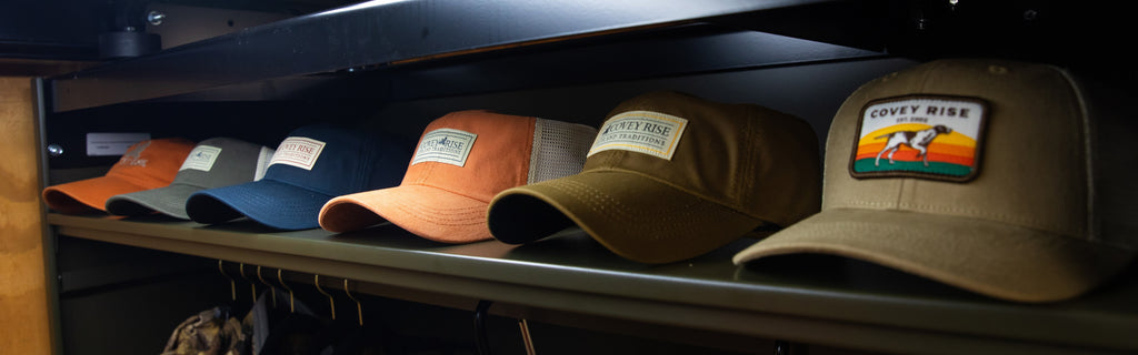 Covey Rise hats lined up on a shelf
